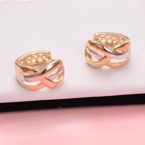 Sterling silver and gold plated huggie hoops.